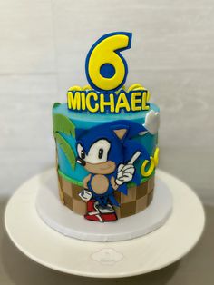 a birthday cake with sonic the hedgehog on it's top and number six