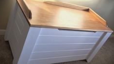 a white cabinet with a wooden counter top