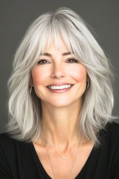 Save this pin for the best layered hair with bangs ideas. These layers of this silver shag give limp locks a major boost. Wispy bangs soften the look while drawing attention to your eyes. Silver Layered Hair, Gray Hairstyles With Bangs, Shoulder Length Grey Hair With Bangs, Silver Hair Bangs, Gray Hair Bangs, Long Grey Hair With Bangs, Feathered Bangs Medium Hair, Shag With Wispy Bangs, Grey Shag Hairstyles