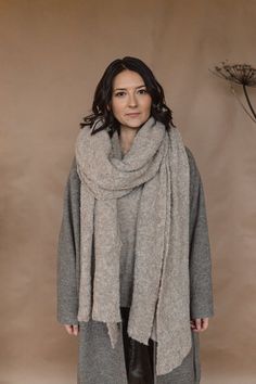 This blanket scarf is made from superfine boucle alpaca yarn. Lightweight, soft and silky, it drapes beautifully, keeps you warm and gives a nice touch to your look thanks to textured structure. Available in 5 colors: beige, light gray, dark gray, charcoal black and brown. The color on the photos is beige. The scarf comes washed, ironed and ready to wear. For more pictures follow us on Instagram on @twillaknitwear COMPOSITION: 89% superfine alpaca/10%nylon SIZE: one size, 270x58cm CARE INSTRUCTI Large Gray Scarf, Cozy Beige Soft Knit Scarves, Cozy Beige Soft Knit Scarf, Beige Alpaca Shawl For Fall, Fall Beige Alpaca Shawl, Beige Alpaca Shawl For Winter, Cozy Alpaca Shawl Scarf, Winter Beige Alpaca Shawl, Oversize Scarf