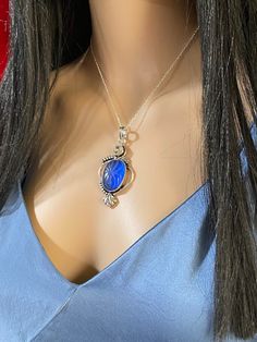 "Beautiful, carved, oval, natural, blue-purplish (depending on the angle, sometimes looks even royal transparent deep blue),chalcedony Pendant necklace, set in a slightly oxidized 925 sterling silver plated copper setting, with 16\" inches long 925 sterling silver chain. --Pendant size: 2.75\"x1.65\" inches, including bail. --Stone Size: 27*20mm. --Stone weight: 10 grams." Oval Sapphire Cabochon Necklace, Oval Sapphire Necklace With Cabochon Cut, Blue Carved Pendant Necklace, Silver Oval Intaglio Necklace, Blue Oval Cabochon Jewelry, Blue Oval Cabochon Necklace, Oval Blue Cabochon Jewelry, Blue Gemstone Necklace With Oval Cabochon, Blue Oval Cabochon Gemstone Necklace