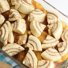 a casserole dish filled with sliced bananas and apples