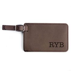 "Travel in style with a monogrammed luggage tag by Lifetime Creations. The vegan leather bag tag is laser engraved with your initials and has a removable identification card. Makes a great personalized gift and stocking stuffer. *DETAILS* * Includes one (1) laser engraved luggage lag * Durable vegan leather material. * Light brown, dark brown and gray luggage tags engrave black; black luggage tag engraves silver. * Each tag measures 4.25\"W x 2.75\"H * Removable identification card. * Easily adj Personalized Brown Luggage Tag For Gift, Everyday Rectangular Leather Luggage Tag, Brown Leather Luggage Tag With Patch, Leather Bag Tag, Personalized Brown Luggage Tag For Travel, Rectangular Leather Luggage Tag, Custom Bag Tags, Monogram Luggage, Custom Luggage