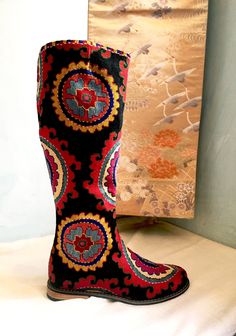 Tall Riding Boot Silk Petit Point with leather interior. These hand made boots are created from hand drawn designs on cotton canvas, inspired by original designs from ancient Uzbekistan textile history.  Height measures 18" with a 3/4" heel and calf measures 16". Size 40 (US 10) available. 100% silk petit point with leather lining with leather sole. Zip closure. Handmade in Uzbekistan. Your purchase preserves and encourages Folk Art Traditions in Uzbekistan, enabling women, families and communit Textile History, Tall Riding Boots, Riding Boot, Paisley Floral, Hand Drawn Design, Long Chain, Leather Interior, Boot Shoes Women, Needlepoint