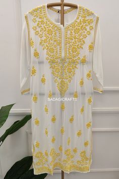 DESCRIPTION ▪ Fabric: Modal ▪ Sleeves: 3/4 Sleeves ▪ Style: Straight Kurti ▪ Length: 44-46 Inches ▪ Occasions: Casual Wear, Office Wear, Festive Wear ▪ Garment Care: Hand Wash Only ▪ Net Content: Only Kurti White Bollywood Kaftan For Festive Occasions, Festive White Bollywood Kaftan, White Anarkali Kaftan With Chikankari Embroidery, White Kaftan With Resham Embroidery For Navratri, Summer Long Sleeve Georgette Traditional Wear, Bollywood White Kaftan With Zari Work, Festive Fitted Straight Kurta Kaftan, White Chikankari Embroidery Kaftan, White Kaftan With Chikankari Embroidery