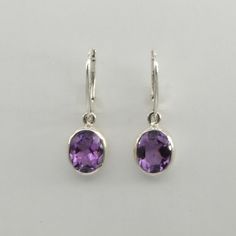 This is a beautiful pair of purple Amethyst Earrings in 925 Sterling Silver. They are made out of Sterling Silver with no nickel so there should be no allergic reaction and nothing will turn green. The silver is not only silver plated or steel but solid 925 Sterling Silver. We usually ship the same day in a nice gift box. Classic Purple Drop Earrings, Classic Teardrop Purple Earrings, Classic Purple Sterling Silver Earrings, Classic Sterling Silver Purple Earrings, Classic Purple Gemstone Earrings, Purple Sterling Silver Earrings, Fine Jewelry, Silver Amethyst Earrings With Multi-stone, Nickel-free Purple Briolette Earrings, Purple Amethyst Earrings