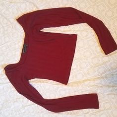 Literally Popped The Tags Off And Tried To Put It On And It Was Way Too Small. The Material Is Nice But Doesnt Have Much Stretch. Super Cute! The Color Is A Very Pretty Berry Red Wine. Trendy Stretch Burgundy Tops, Trendy Burgundy Stretch Top, Fitted Red Long Sleeve Crop Top, Fitted Burgundy Crop Top, Red Fitted Crop Top For Fall, Fitted Red Crop Top For Fall, Urban Outfitters Fitted Solid Crop Top, Red Urban Outfitters Crop Top, Red Long Sleeve Cotton Crop Top