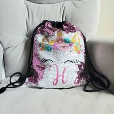 Are you looking for a unique UNICORN gift for a birthday girl? This personalized drawstring backpack, or tote makes a great gift for any birthday girl who loves unicorns or ballerinas. ☑️Baby, Toddler, Youth ☑️Holds Everyday Needs ☑️Baby Bottles, Wipes, Diapers ☑️ Library Books, Journals ☑️Toys, Small Tablets ☑️Extra pair of clothes, water bottle, snacks 🎉This is a 4 in 1 for parties! 🎈 1) Birthday Gift 2) Treat Favor Gift Bag 3) Party Guest Souvenir 4) Gift Wrapping Bag (totes) ➡️Bags available: D for Drawstring Bags, T for Totes, B for Backpacks How to Order  1) Choose your bag 2) Choose your Image (Unicorn or Ballerina Shoes 1-3) Textbox : 1)Enter Name 2) Enter Cursive , Non Cursive Text, or Monogram Text 💥NOTE: If you do not choose a font the default is cursive text. Shiny Pink bags Pink Backpack Gift For End Of School Year, Pink Backpack For End Of School Year Gift, Playful Unicorn Print Bags, Cute Multicolor Birthday Bags, Cute Multicolor Bags For Birthday, Playful Pink Bag For Birthday, Purple Bags For End Of School Year Gift, Cute Adjustable Bag For Gift, Fun Pink Personalized Bags