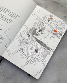 an open book with some drawings on it