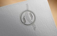 a close up of a logo on a piece of paper with a football in the middle