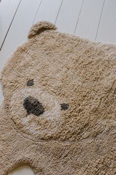 a teddy bear rug is on the floor