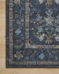 a blue rug with flowers on it