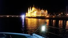 a boat traveling down the river at night