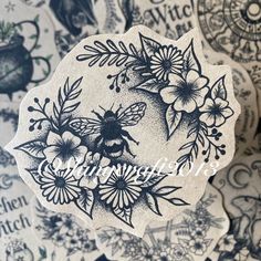 some black and white stickers on top of each other with flowers in the middle