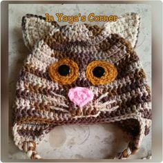 a crocheted cat hat is shown with the words in yaya's corner