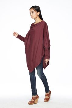 "🚚..ALL ORDERS ARE SHIPPED VIA DHL EXPRESS MAIL This batwing tunic is a very \"cool\" addition to any wardrobe! With a unique drawstrings on bottom hem of tunic provide plenty of options for changing the look. Cowl neckline, batwing sleeves with wide cuffed and oversized side pocket; can be worn layered over leggings, pants, or skirt for even more dramatic effects. * Pull-on style * Cowl neckline * Dropped shoulders * Long sleeves with wide ribbed cuff * Oversize side pocket * Asymmetrical hem Fall Tops With Asymmetrical Hem For Layering, Fall Tops For Layering With Asymmetrical Hem, Fall Layering Tops With Asymmetrical Hem, Asymmetrical Tops For Layering In Fall, Asymmetrical Tops For Fall Layering, Winter Plain Top With Asymmetrical Hem, Casual Red Long Sleeve Tunic, Fall Tops With Asymmetrical Hem, Solid Color Fall Tops With Asymmetrical Hem