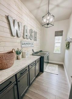 a laundry room with washer and dryer in it