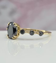 Everyday Wear Amazing Handmade Black Gold Ring For Her. 1 Carat Oval Black Gem Amazing Handmade Gold Ring For Her Black Gold Ring, ring For Her, Amazing gold ring, Handmade ring. Setting Options (Choose & Checkout) White, Rose or Yellow Gold 14k or 18k 4-14 US for your choice Center Stone: Oval Cut 7.50 x 5.50 mm Carat weight: 1.01 ct Color: Black Clarity: AAA Cut: Excellent Natural Spinel Setting: 4 Prongs Gemological Certificate  Side Stone: 6 Diamonds Carat weight:: 0.18 ct Color: Black Clarity: AAA Cut: Excellent Band Details: 1.50 mm thickness: 1.40 mm width Why ∙ It's ∙ Awesome ✓ Gemological Certificate  ✓ 20 Years of Experience ✓ 100% Original Designs ✓ Conflict-Free Diamonds & Gemstones ✓ Free USA Shipping ✓ Custom Orders ✓ Contact us for special request Easy Payment Option: You ca Handmade Gold Ring, Black Gold Ring, Black Stone Ring, Black Gems, Black Diamond Ring, Shape Art, Ring Oval, Handmade Gold, Rings For Her