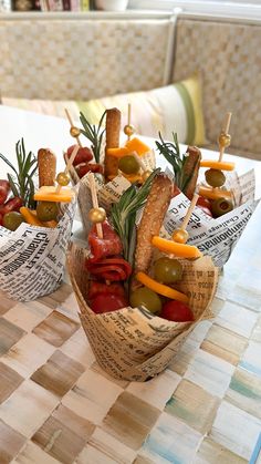 small baskets filled with food sitting on top of a table