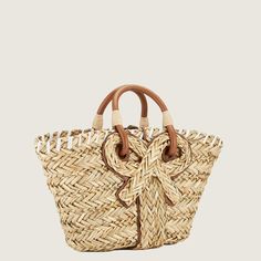 Luxury Woven Leather Straw Bag In Bucket Shape, Luxury Woven Shoulder Bag For Shopping, Luxury Woven Straw Basket Bag, Luxury Straw Bucket Bag With Handles, Luxury Woven Bucket Bag For Beach, Luxury Handwoven Beach Bag With Top Handle, Luxury Leather Trim Straw Bag For Summer, Luxury Women's Woven Leather Beach Bag, Luxury Spring Straw Bag With Leather Handles