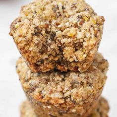 three oatmeal cookies stacked on top of each other in front of a white background