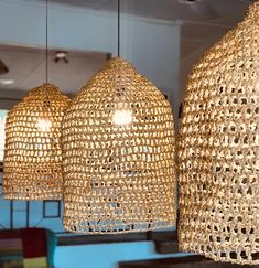 three light fixtures hanging from the ceiling in a room