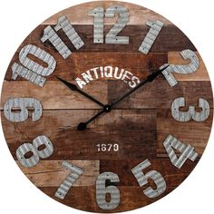 a wooden clock with numbers on it and the word antiques written in white letters is shown