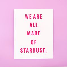 we are all made of stardust on a pink background