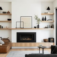 a living room filled with furniture and a fire place