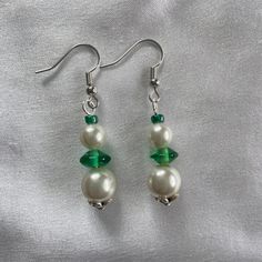 Elegant Handmade Green Beaded Earrings, Elegant Green Beaded Drop Earrings, Handmade Green Pearl Earrings For Gift, Elegant Green Beaded Crystal Earrings, Green Pearl Drop Earrings As Gift, Green Pearl Drop Earrings For Gift, Green Emerald Earrings With Pearl Drop, Green Beaded Earrings With Round Beads, Green Pearl Drop Earrings For May Birthstone