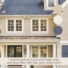 a house with blue and white paint on the front door, window panes in different colors