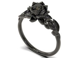 a black diamond flower ring on a white background