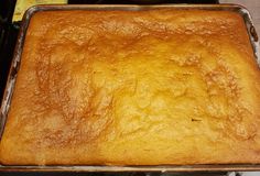 a square cake sitting on top of a metal pan