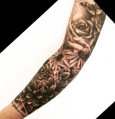 a woman's arm with flowers and butterflies on it