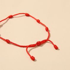 Item Type: Bracelets.Material: Cotton.Color: Red.Length: 16 - 26 cm / 6.3 - 10 inch.Quantity: 2 pcs.Features:Classic Kabbalah Red Rope String Bracelet.Lovely fashion red string bracelet - Simple and elegant.Red string bracelet on the wrist.Braided by Buddhist monks, while reciting mantras over each knot.Package Includes:2 x 7 Knots Red String Luck Bracelets. Casual Red Handmade Friendship Bracelets, Handmade Red Casual Friendship Bracelets, Trendy Red Bracelet For Festival, Trendy Red Beaded Bracelets For Festival, Trendy Red Festival Jewelry, Casual Red Braided Bracelets As Gift, Casual Red Braided Bracelets For Gift, Bohemian Red Beaded Bracelets For Vacation, Trendy Red Friendship Bracelets For Festivals