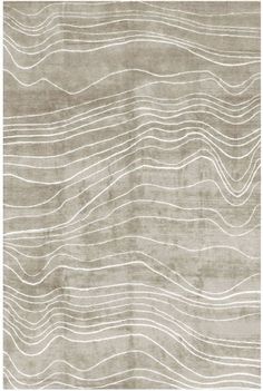 a beige rug with wavy lines on it