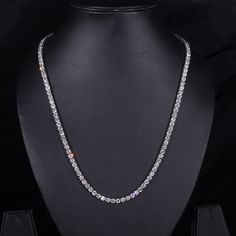 This Diamond Tennis Necklace is a beautiful statement piece made with 4.0 MM Round Lab Grown Diamonds on a Tennis Chain. Show your unique style with this eye-catching and elegant diamond necklace. "𝐓𝐨𝐠𝐞𝐭𝐡𝐞𝐫 𝐰𝐞 𝐜𝐚𝐧 𝐦𝐚𝐤𝐞 𝐭𝐡𝐞 𝐰𝐨𝐫𝐥𝐝 𝐚 𝐛𝐞𝐭𝐭𝐞𝐫 𝐩𝐥𝐚𝐜𝐞 𝐟𝐨𝐫 𝐥𝐢𝐯𝐢𝐧𝐠, 𝐥𝐞𝐭’𝐬 𝐠𝐨 𝐰𝐢𝐭𝐡 𝐦𝐢𝐧𝐢𝐧𝐠-𝐟𝐫𝐞𝐞 𝐝𝐢𝐚𝐦𝐨𝐧𝐝𝐬 𝐚𝐧𝐝 𝐡𝐚𝐧𝐝 𝐨𝐯𝐞𝐫 𝐚 𝐛𝐞𝐭𝐭𝐞𝐫 𝐭𝐨𝐦𝐨𝐫𝐫𝐨𝐰 𝐚𝐧𝐝 𝐜𝐥𝐞𝐚𝐧 𝐞𝐚𝐫𝐭𝐡 𝐭𝐨 𝐭𝐡𝐞 𝐜𝐨𝐦𝐢𝐧𝐠 𝐠𝐞𝐧𝐞𝐫𝐚𝐭𝐢𝐨𝐧𝐬. Luxury Diamond Cut Chain Necklace For Wedding, Luxury Wedding Chain Necklace With Diamond Cut, Round Tennis Necklace With Clavicle Chain For Wedding, Classic Crystal Necklace In Diamond White, Luxury Chain Necklace For Weddings, Luxury Diamond Cut Crystal Necklace, Luxury Crystal Necklace With Diamond Cut, Luxury Crystal Diamond Cut Necklace, Diamond Cut Crystal Necklace In Diamond White