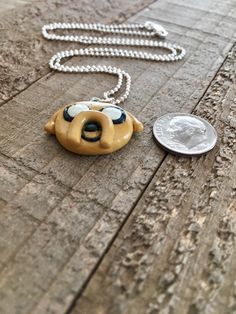 "Mathematical! Do you love Adventure Time? This Jake the dog necklace would make the perfect gift for friends and family! This charm is hand made from polymer clay. I do not use a mold for any of the charms I make, so each one comes out uniquely different. :) Each charm also has a few coats of a water based varnish to protect it. You can choose from one of four 18\" chains at checkout. Do not wear while swimming or showering. Please note that these are not cast plastic, they are made out of clay Adventure Time Gift, Jake The Dog, Study Apps, Stamped Spoons, State Necklace, Jake The Dogs, Ceramic Necklace, Dog Necklace, Clay Necklace