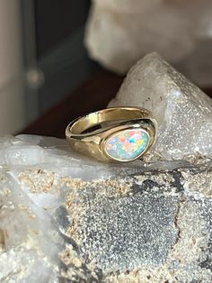 I've been coveting this opal for a long time and felt like it was ready to be set, I wanted to make a band and setting that emphasized the beauty of the opal.  This is a high end opal that deserved to be set in 18k gold. Size 7 Oval Opal Rings With Polished Finish, Polished Opal Oval Cabochon Ring, Polished Opal Ring In Oval Cabochon Shape, Opal Oval Cabochon Ring With Polished Finish, Gold Ethiopian Opal Ring Hallmarked, Heirloom Opal Cabochon Ring, Heirloom Cabochon Opal Ring, Fine Jewelry 14k Gold Opal Ring With Polished Finish, Hallmarked 14k Gold Opal Ring, Oval Shape