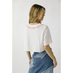 Monochromatic heart embroidered t-shirt cropped top. It shows a round neckline, short sleeve, and oversized boxy cropped silhouette. It also has embroidered pink and red hearts around the top of the shirt. Trendy Boxy Short Sleeve Crop Top, Short Sleeve Tops With Heart Patch, Cute Cotton Cropped T-shirt, Trendy Short Sleeve Tops With Heart Patch, Casual Cotton Crop Top With Heart Graphic, Casual Embroidered Cropped Top, Cute Cropped T-shirt For Spring, Trendy Cotton Crop Top With Heart Graphic, T Shirt Crop Top