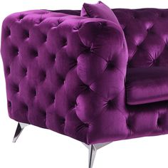 a purple velvet couch with chrome legs