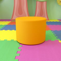 a brightly colored children's play room with toys