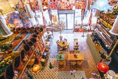 an overhead view of a restaurant with tables, chairs and decorations on the wall above