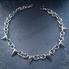 Punk/grunge style chunky spike rivet choker necklace in silver! Unisex. Chain is made from stainless steel.  Spike rivets are made of copper and measure  Available in 3 different sizes: Small ( shown in photographs) Measures 14 inches + 3 inch extension chain  Medium  Measures 16.5 inches + 3 inch extension chain  Large  Measures 19 inches + 3 inch extension chain  Small necklace comes with 6 spikes, Medium with 8 spikes and large with 10 spikes. Please don't hesitate to contact me with any quer Silver Grunge Choker For Concert, Rock Style Jewelry Choker For Alternative Fashion, Rock Style Choker Jewelry For Alternative Fashion, Rock Style Choker For Alternative Fashion, Silver Emo Choker For Concert, Alternative Style Silver Choker For Concert, Rock Style Metal Jewelry For Alternative Fashion, Spiked Choker For Concerts, Spiked Choker For Concert