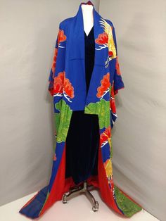 "Authentic vintage Japanese Uchikake wedding kimono coat purchased in Japan in the 50's. Gorgeous traditional robe - worn like a coat (no obi). Padded hem and furisode sleeves. Very elaborate hand painted and embroidered design, especially dramatic on the gold thread cranes. Includes applique work and alot of handwork. Bright, colorful, and festive. Vibrant peacock blue base color. Overall condition very good, looks never worn but has some fading from storage - please see close up and full robe Vintage Long Kimono For Wedding, Ceremonial Vintage Kimono, Vintage Wedding Kimono With Kimono Sleeves, Vintage Red Kimono For Wedding, Antique Wedding Gown, Wedding Coat, Creatures Of Comfort, Applique Work, Wedding Kimono