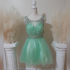 Women's Short-Length Mint Green Dress With Rhinestone Detailing Sleeveless Rhinestone Dress For Spring, Spring Cocktail Dresses With Rhinestones, Sleeveless Rhinestone Spring Dress, Fitted Green Dresses With Rhinestones, Spring Mini Dress With Rhinestones, Light Green Sparkly Dress Short, Spring Rhinestone Mini Dresses, Green Embellished Mini Dress, Mint Green Sparkly Dress