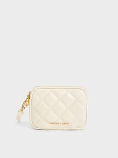 No matter what they adorn, quilted textures have the ability to instantly elevate a design, including this charming wristlet pouch. In a creamy, elegant white finish, it looks extra chic and polished. The gold-tone metallic accents further refine the design, giving it a sophisticated vibe. Whether you are heading out for a quick lunch or running a short errand, this compact yet functional wristlet pouch will be the perfect companion. Charles And Keith, Belt Ring, Wristlet Pouch, Quick Lunch, Charles Keith, Kids Sale, Metallic Accents, Sales Gifts, Trending Shoes