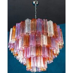 a multi - colored chandelier hanging from a ceiling