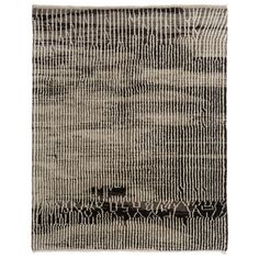 a black and white rug with an abstract design on the bottom, it is made out of