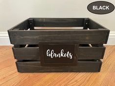 a wooden crate sitting on top of a hard wood floor